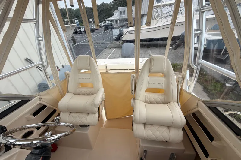 Slide: The Image of Interior view of a 2017 Grady-White Gulfstream 232 boat with plush seating. - 8