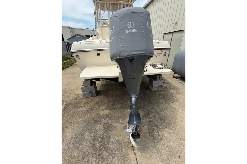 Slide: The Image of 2017 Grady-White Gulfstream 232 boat with Yamaha outboard motor, docked on concrete blocks. - 15