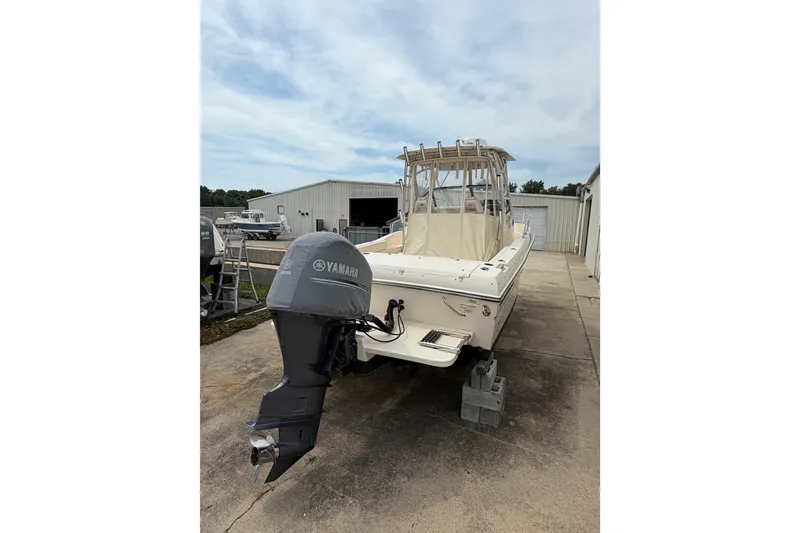 Slide: The Image of 2017 Grady-White Gulfstream 232 boat with Yamaha outboard motor, parked outdoors. - 3