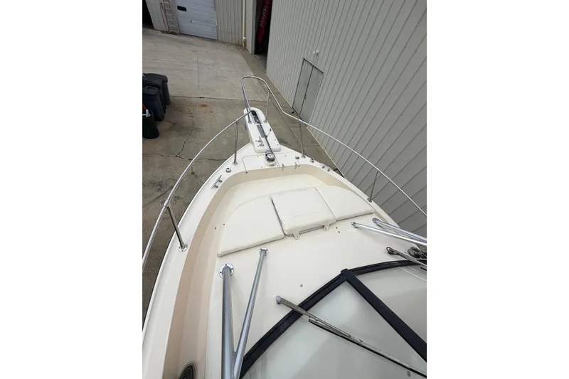 Slide: The Image of 2017 Grady-White Gulfstream 232 boat bow view in a storage area. - 11