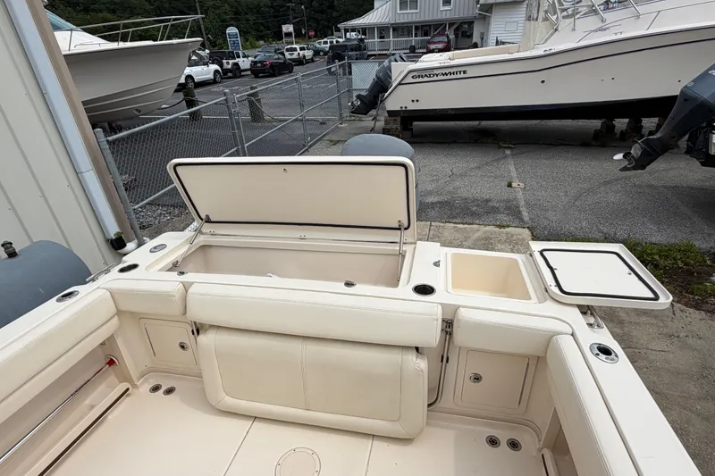 Slide: The Image of 2017 Grady-White Gulfstream 232 boat interior with open storage compartments. - 14