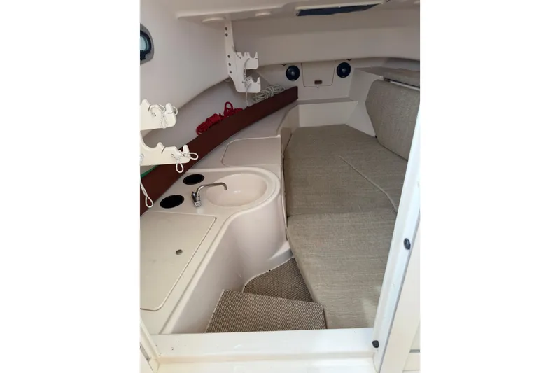 Slide: The Image of 2017 Grady-White Gulfstream 232 cabin interior with seating and sink. - 10