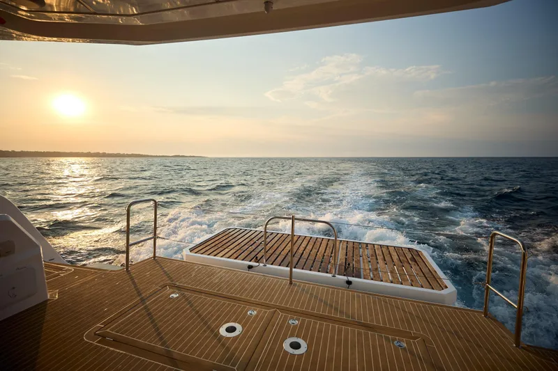 Slide: The Image of Sunset view from the deck of a 2025 Omaya 50 Power Catamaran. - 31