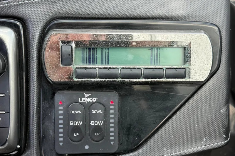 Slide: The Image of Control panel of a 2015 Monterey 288SS Super Sport boat with Lenco trim tab switches. - 41