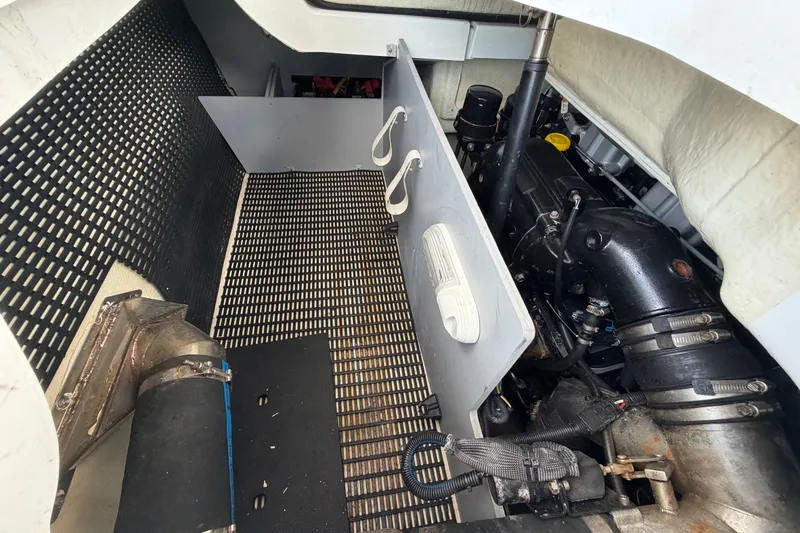Slide: The Image of Engine compartment of a 2015 Monterey 288SS Super Sport boat, showcasing mechanical components. - 17