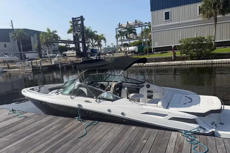 Slide: The Image of 2015 Monterey 288SS Super Sport boat docked at a marina with palm trees. - 6