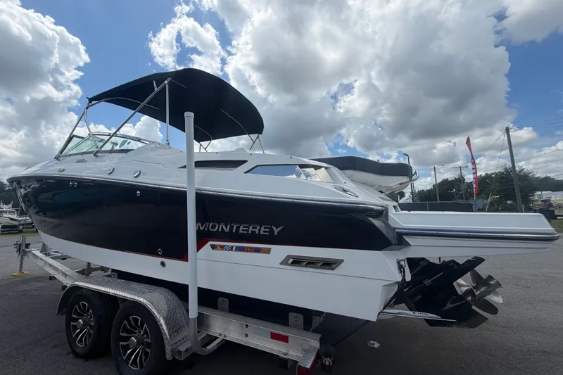 Slide: The Image of 2015 Monterey 288SS Super Sport boat on trailer under cloudy sky. - 8