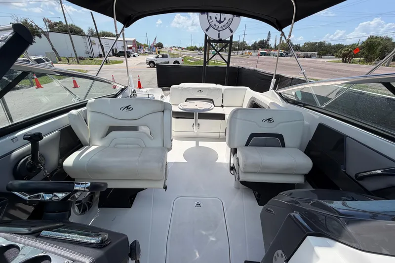 Slide: The Image of 2015 Monterey 288SS Super Sport boat interior with white seating and steering wheel. - 57