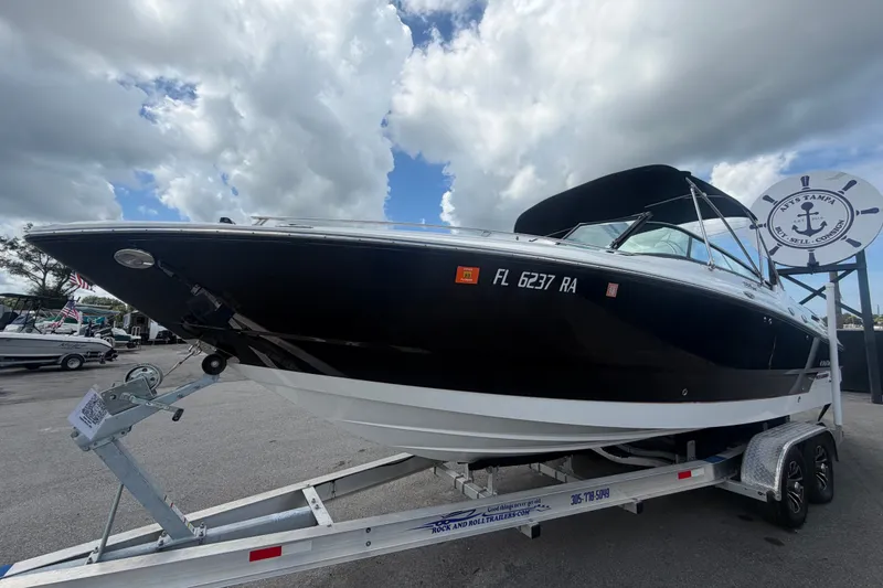 Slide: The Image of 2015 Monterey 288SS Super Sport boat on trailer under cloudy sky. - 10