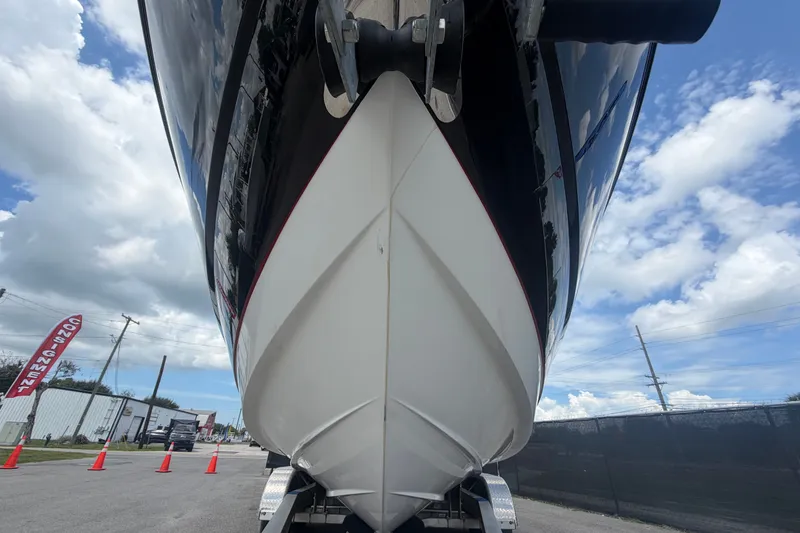 Slide: The Image of 2015 Monterey 288SS Super Sport boat on trailer under cloudy sky. - 12