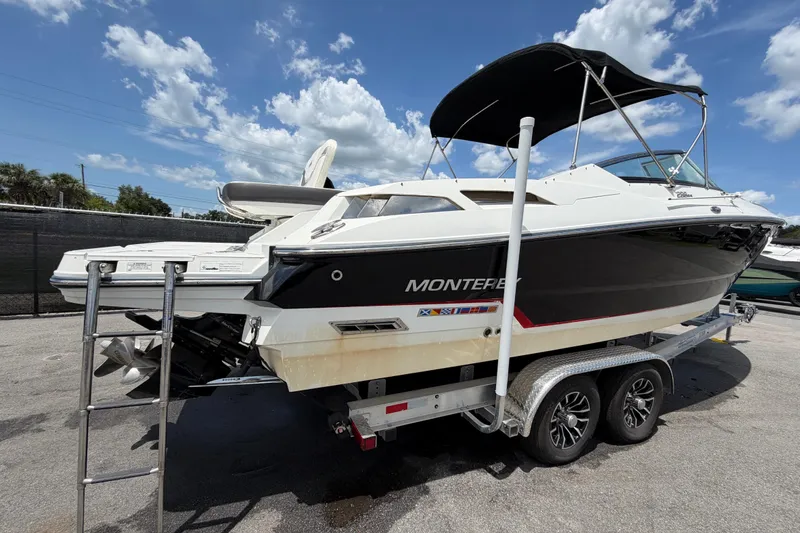 Slide: The Image of 2015 Monterey 288SS Super Sport boat on trailer under blue sky. - 2