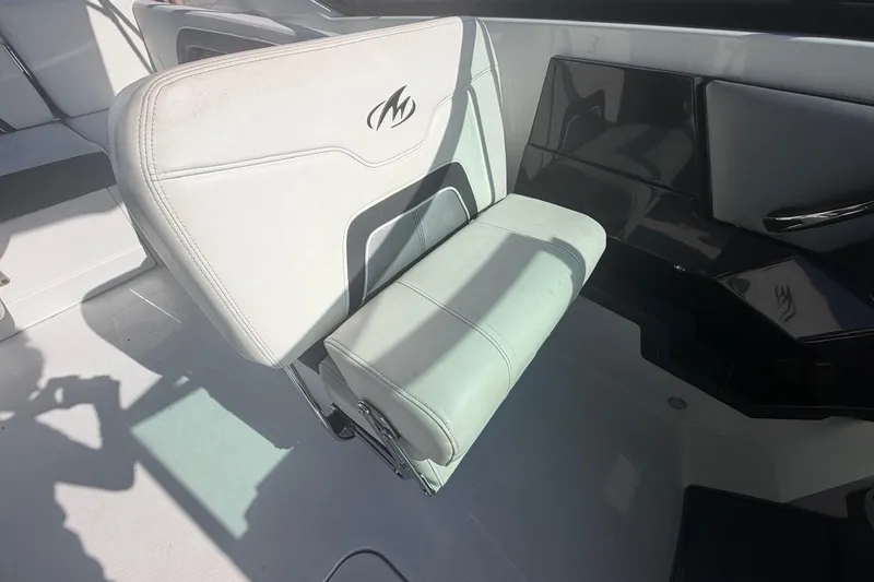 Slide: The Image of 2015 Monterey 288SS Super Sport boat seat with logo, featuring sleek white and black design. - 21