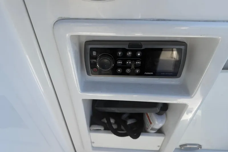 Slide: The Image of Fusion stereo system on a 2015 Monterey 288SS Super Sport boat dashboard. - 22
