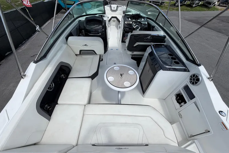 Slide: The Image of 2015 Monterey 288SS Super Sport boat interior with seating, table, and helm. - 20