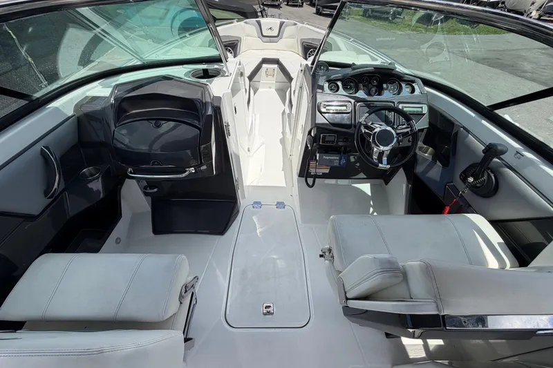 Slide: The Image of Interior of a 2015 Monterey 288SS Super Sport boat, featuring sleek seating and modern controls. - 28