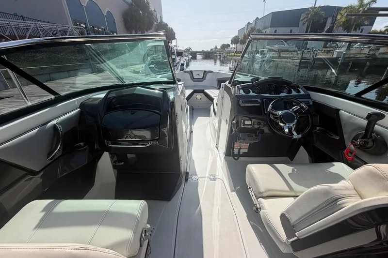 Slide: The Image of Interior view of a 2015 Monterey 288SS Super Sport boat, showcasing helm and seating. - 15