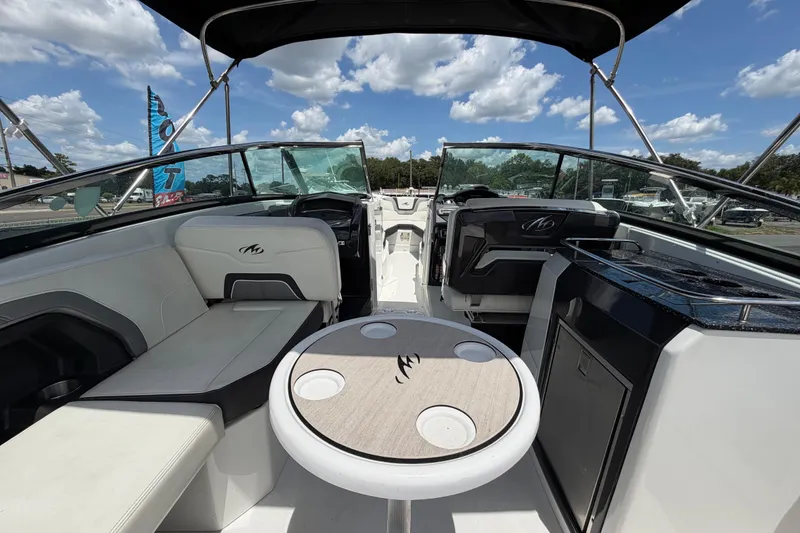 Slide: The Image of Interior of a 2015 Monterey 288SS Super Sport boat with seating and table. - 21