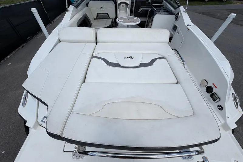 Slide: The Image of 2015 Monterey 288SS Super Sport boat interior with white seating and sleek design. - 15
