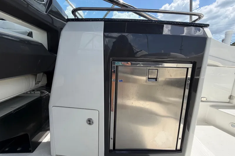 Slide: The Image of 2015 Monterey 288SS Super Sport boat interior with stainless steel compartment. - 25