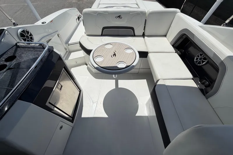 Slide: The Image of Interior of a 2015 Monterey 288SS Super Sport boat with seating and table. - 59