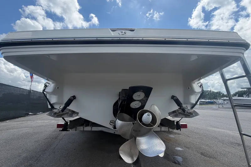 Slide: The Image of The image shows the stern of a 2015 Monterey 288SS Super Sport boat with dual propellers. - 4