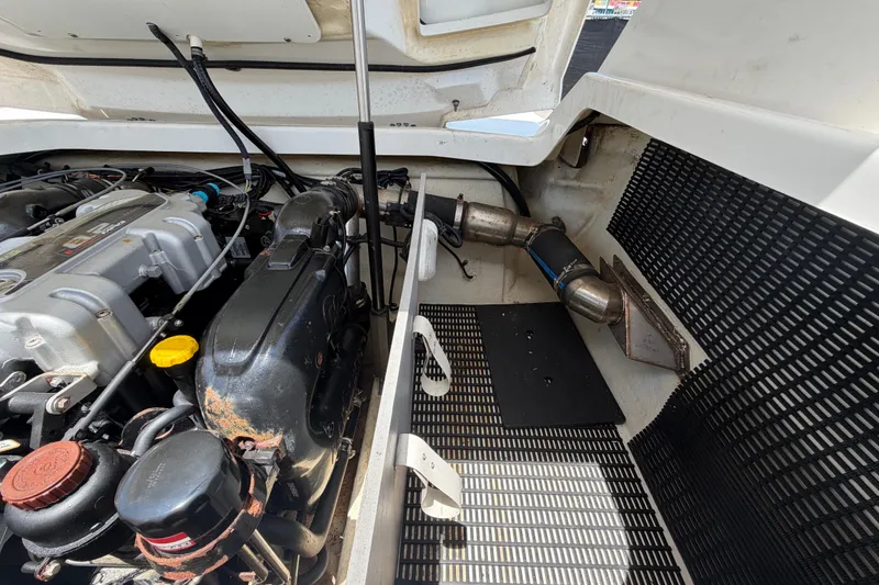 Slide: The Image of Engine compartment of a 2015 Monterey 288SS Super Sport boat, showcasing mechanical components. - 67