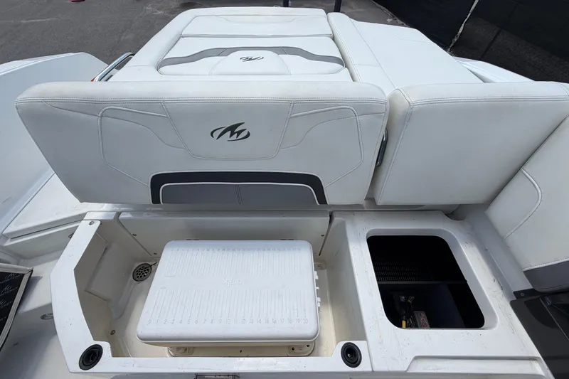 Slide: The Image of 2015 Monterey 288SS Super Sport boat interior with storage compartments and seating. - 69