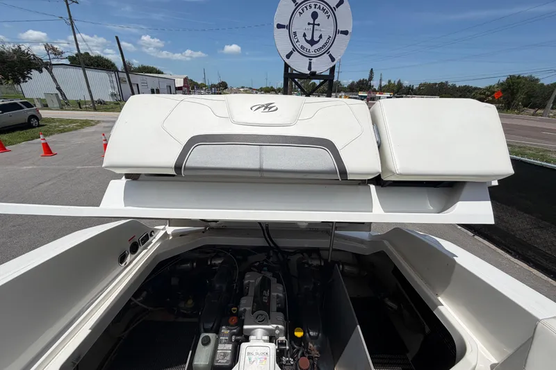 Slide: The Image of Open engine compartment of 2015 Monterey 288SS Super Sport boat under sunny sky. - 62
