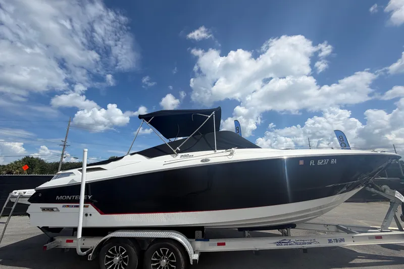 Slide: The Image of 2015 Monterey 288SS Super Sport boat on trailer under a partly cloudy sky. - 82