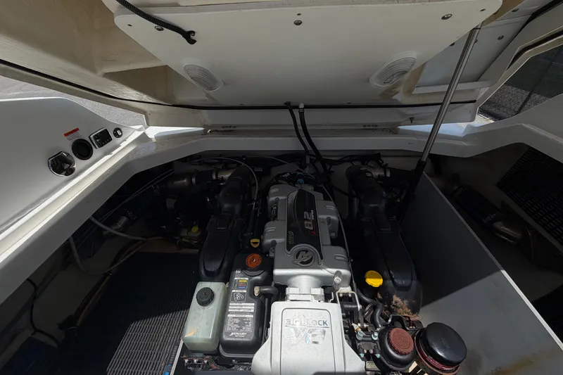 Slide: The Image of Engine compartment of a 2015 Monterey 288SS Super Sport boat, showcasing mechanical components. - 63