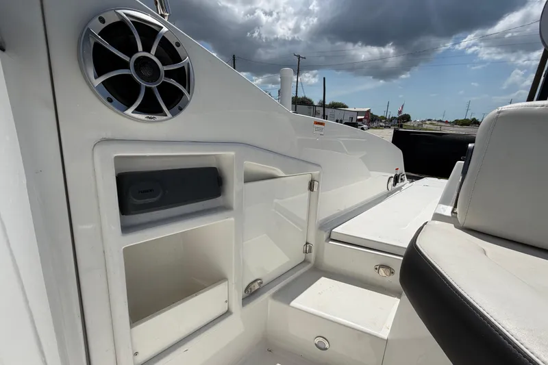 Slide: The Image of 2015 Monterey 288SS Super Sport boat interior with speaker and storage compartments. - 72