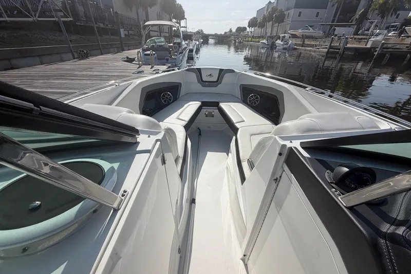 Slide: The Image of 2015 Monterey 288SS Super Sport boat interior with seating and waterfront view. - 23