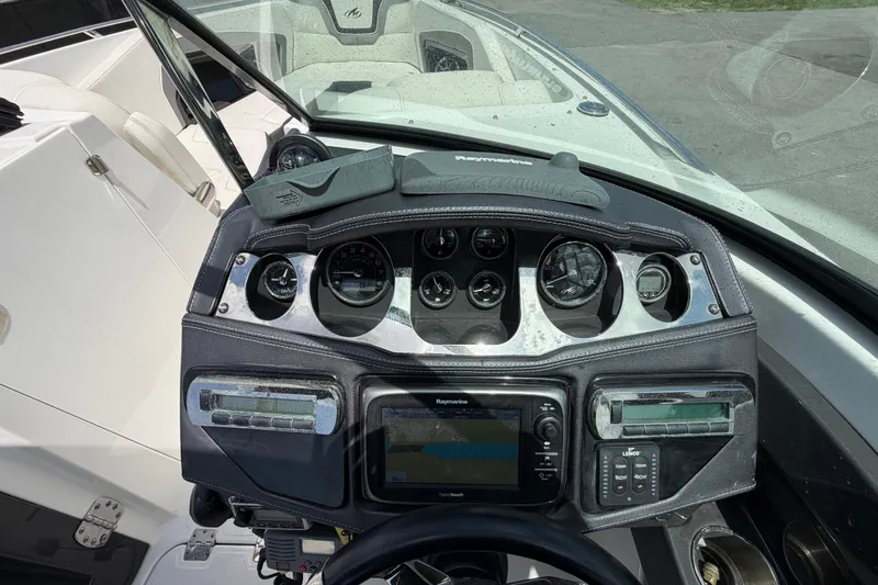 Slide: The Image of Dashboard of a 2015 Monterey 288SS Super Sport boat with navigation instruments. - 33