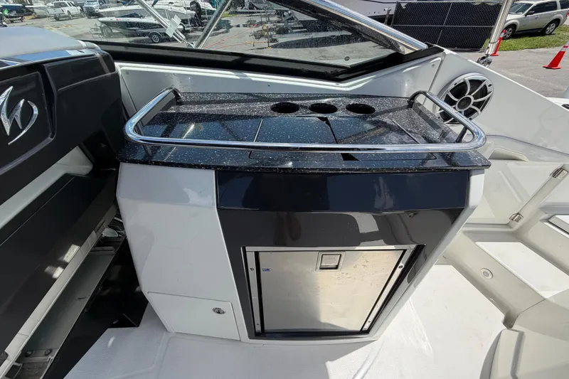 Slide: The Image of Interior view of a 2015 Monterey 288SS Super Sport boat with a sleek kitchenette. - 23