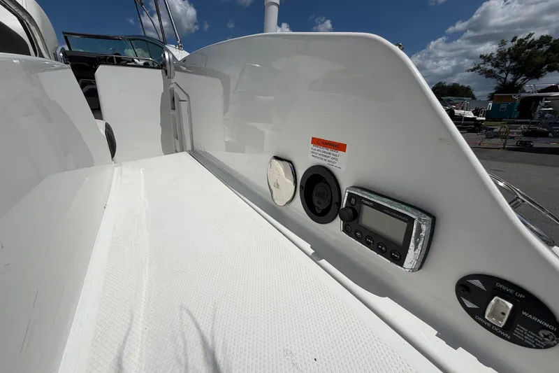 Slide: The Image of 2015 Monterey 288SS Super Sport boat dashboard with controls and warning labels. - 76