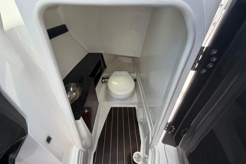 Slide: The Image of 2015 Monterey 288SS Super Sport boat bathroom with toilet and sink. - 46