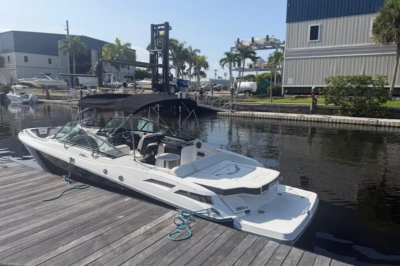Slide: The Image of 2015 Monterey 288SS Super Sport boat docked at marina with palm trees. - 5
