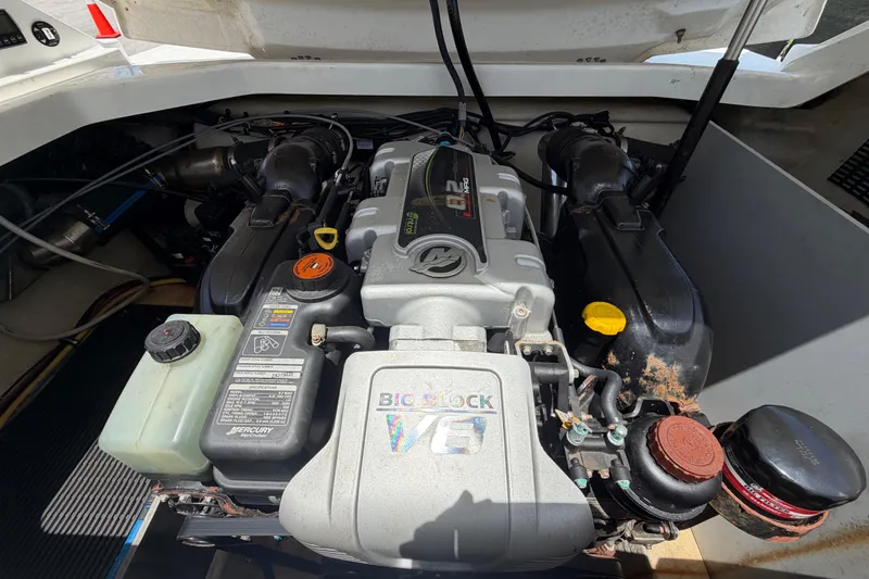 Slide: The Image of Engine compartment of a 2015 Monterey 288SS Super Sport boat, featuring a powerful V8 engine. - 65