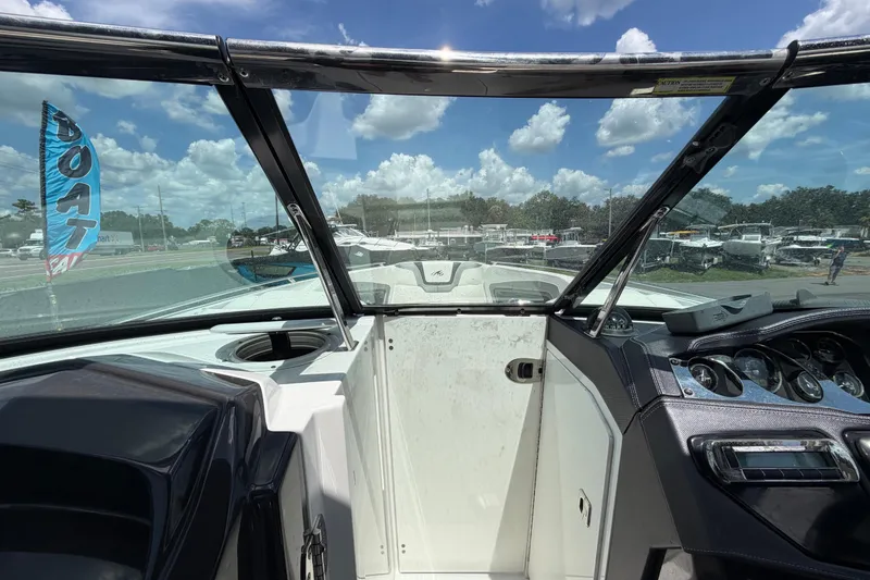 Slide: The Image of Interior view of a 2015 Monterey 288SS Super Sport boat with dashboard and windshield. - 48
