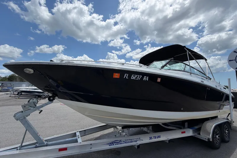Slide: The Image of 2015 Monterey 288SS Super Sport boat on trailer under cloudy sky. - 10