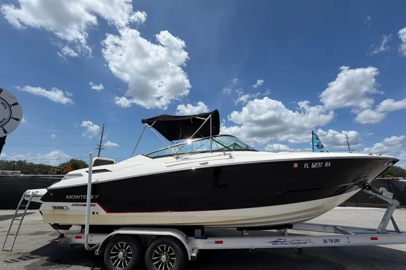 Slide: The Image of 2015 Monterey 288SS Super Sport boat on trailer under blue sky. - 1