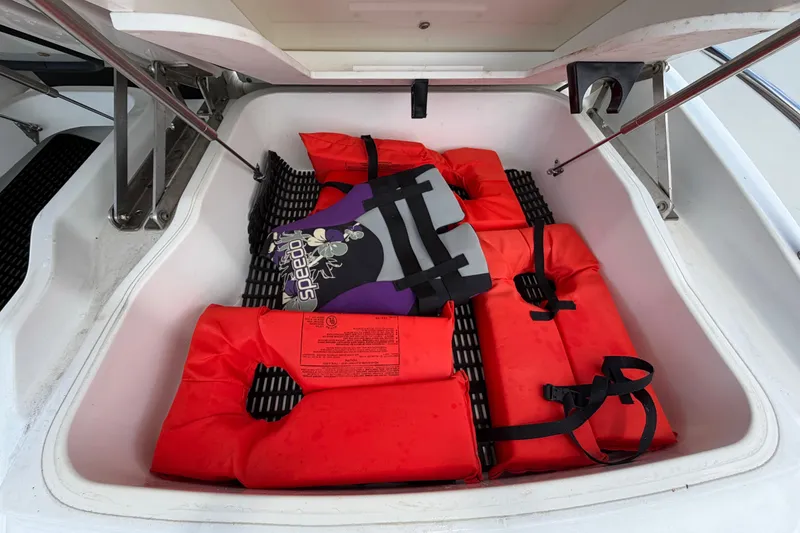 Slide: The Image of Storage compartment of 2015 Monterey 288SS Super Sport with life jackets. - 18