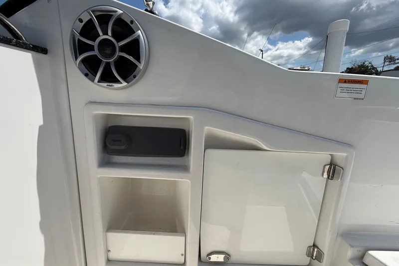 Slide: The Image of 2015 Monterey 288SS Super Sport boat interior with speaker and storage compartments. - 73