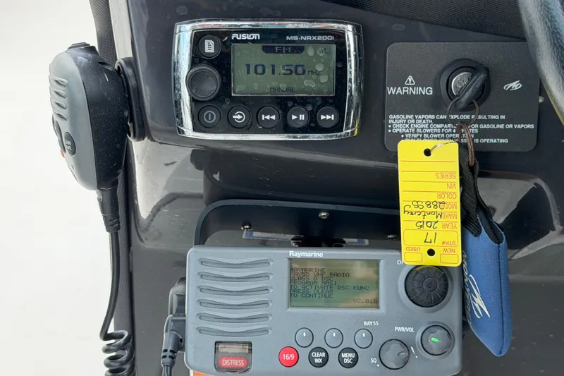 Slide: The Image of Control panel of a 2015 Monterey 288SS Super Sport boat with radio and warning labels. - 38
