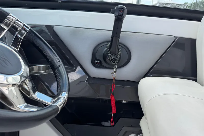 Slide: The Image of Interior of a 2015 Monterey 288SS Super Sport boat, featuring steering wheel and throttle controls. - 42