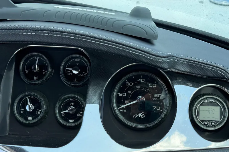 Slide: The Image of Dashboard of a 2015 Monterey 288SS Super Sport boat with various gauges and dials. - 36