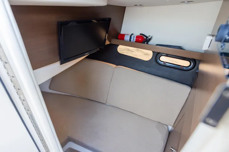 Slide: The Image of Interior cabin of 2016 Sea Ray SLX 350 with TV and fire extinguisher. - 30