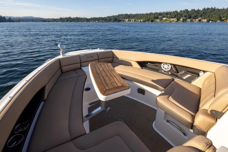 Slide: The Image of Luxurious 2016 Sea Ray SLX 350 boat interior with plush seating and scenic water view. - 17