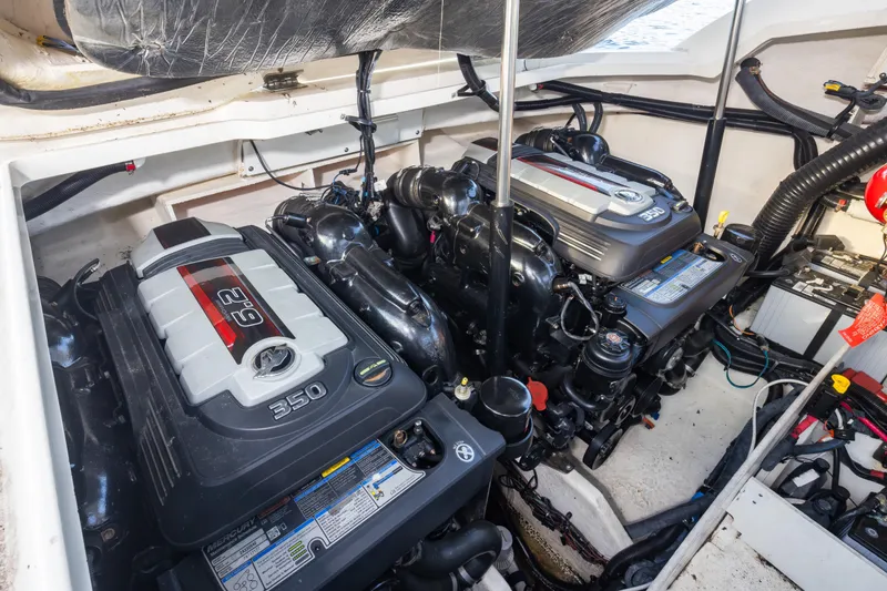 Slide: The Image of Engine compartment of a 2016 Sea Ray SLX 350 boat, featuring dual Mercury 350 engines. - 9
