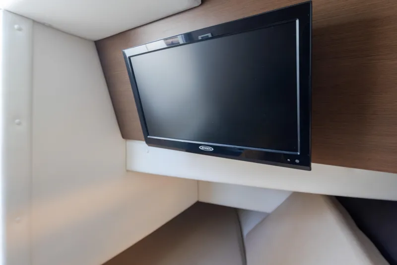 Slide: The Image of Flat-screen TV in 2016 Sea Ray SLX 350 boat interior, mounted on wooden panel. - 31